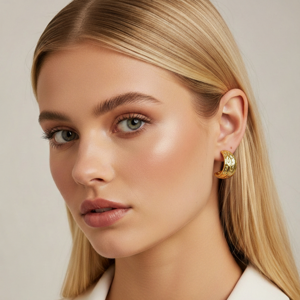 Modern textured wave hoop earrings in gold or silver. Lightweight sculptural design. Perfect for everyday elegance & office style.