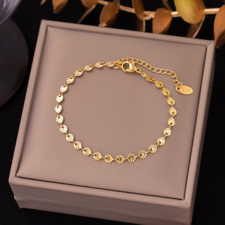 Delicate gold chain bracelet with textured fan-shaped links. Adjustable fit, stackable design. Perfect for everyday elegance & layering.