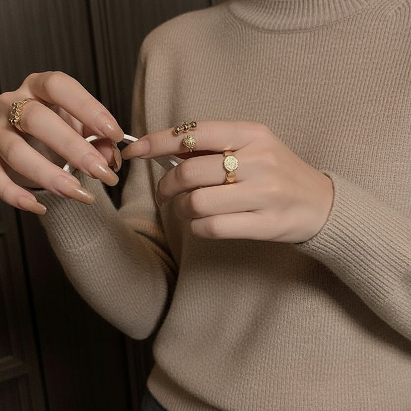 Modern gold disc ring with pavé cubic zirconia. Adjustable sculptural design, stackable. Perfect for statement style & everyday elegance.