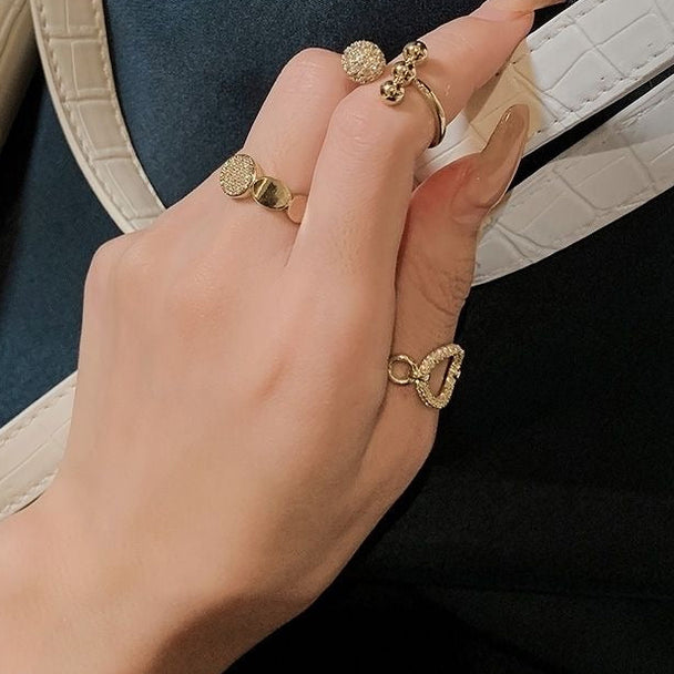 Minimalist gold open ring with pavé cubic zirconia circle. Adjustable fit, stackable design. Perfect for everyday elegance & layering.
