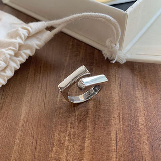 925 sterling silver open ring with geometric double-layer design. Adjustable fit, hypoallergenic. Modern minimalist statement piece perfect for everyday wear.