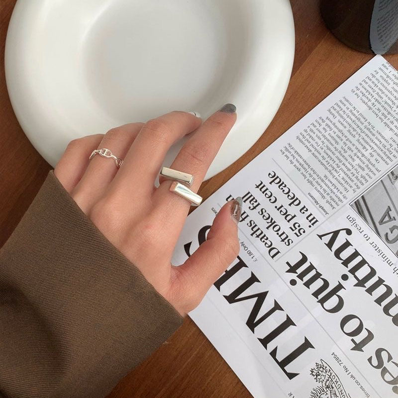 925 sterling silver open ring with geometric double-layer design. Adjustable fit, hypoallergenic. Modern minimalist statement piece perfect for everyday wear.