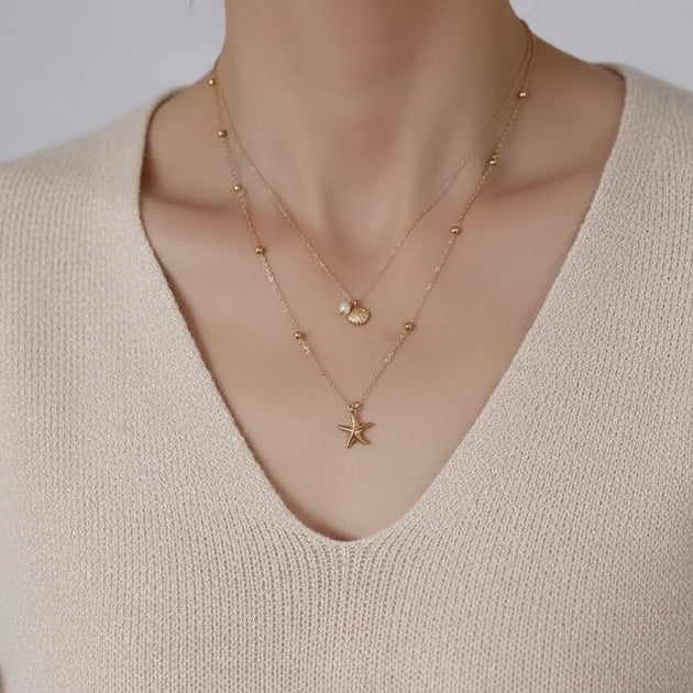 Delicate layered necklace set with seashell, pearl & starfish charms. Gold or silver coastal jewelry. Wear together or separately. Perfect for everyday style.