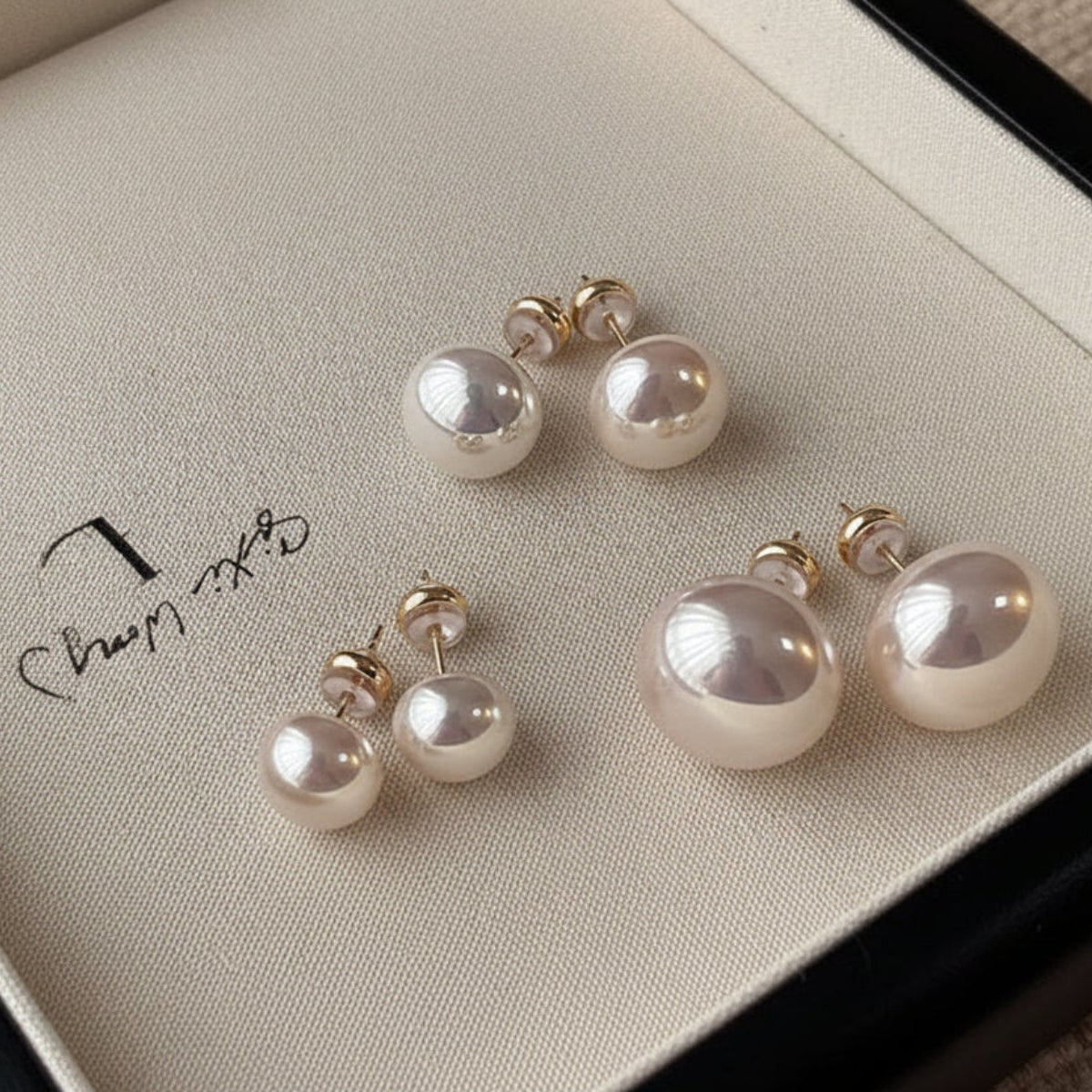 Elegant crystal pearl stud earrings in white or pink. 18K gold-plated, Swarovski pearls, 10-14mm sizes. Perfect for everyday elegance & special occasions.