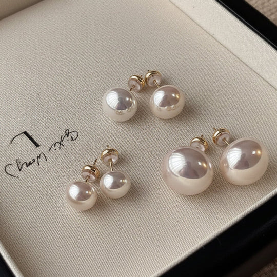 Elegant crystal pearl stud earrings in white or pink. 18K gold-plated, Swarovski pearls, 10-14mm sizes. Perfect for everyday elegance & special occasions.