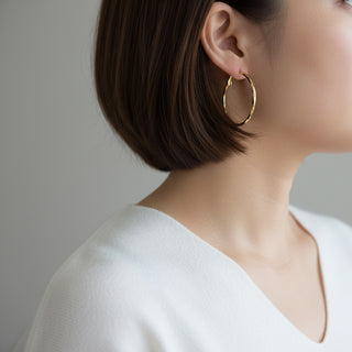 Modern textured hoop earrings in gold or silver with hammered finish. Lightweight medium hoops. Perfect for everyday elegance & minimalist style.