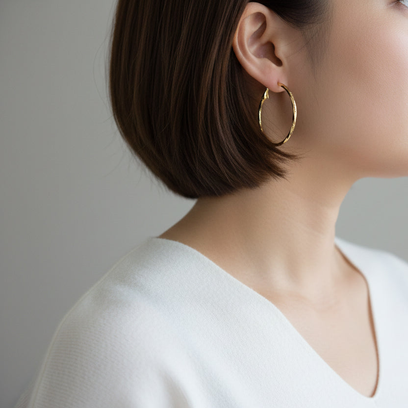 Modern textured hoop earrings in gold or silver with hammered finish. Lightweight medium hoops. Perfect for everyday elegance & minimalist style.