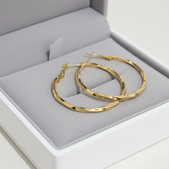 Modern textured hoop earrings in gold or silver with hammered finish. Lightweight medium hoops. Perfect for everyday elegance & minimalist style.
