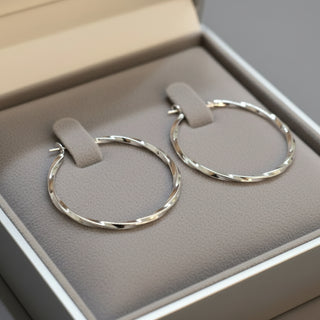 Modern textured hoop earrings in gold or silver with hammered finish. Lightweight medium hoops. Perfect for everyday elegance & minimalist style.