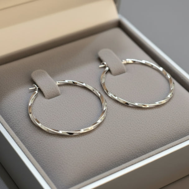 Modern textured hoop earrings in gold or silver with hammered finish. Lightweight medium hoops. Perfect for everyday elegance & minimalist style.
