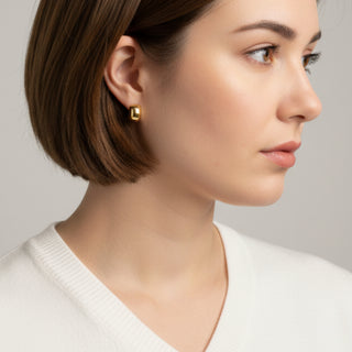 Bold hammered gold stud earrings with textured cushion design. Lightweight, sculptural style. Perfect for everyday elegance & office wear.