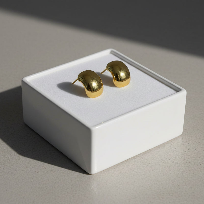 Bold hammered gold stud earrings with textured cushion design. Lightweight, sculptural style. Perfect for everyday elegance & office wear.