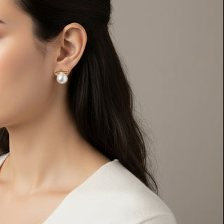 Minimalist gold bar stud earrings with white pearls. Lightweight, elegant design. Perfect for office wear & everyday sophistication.