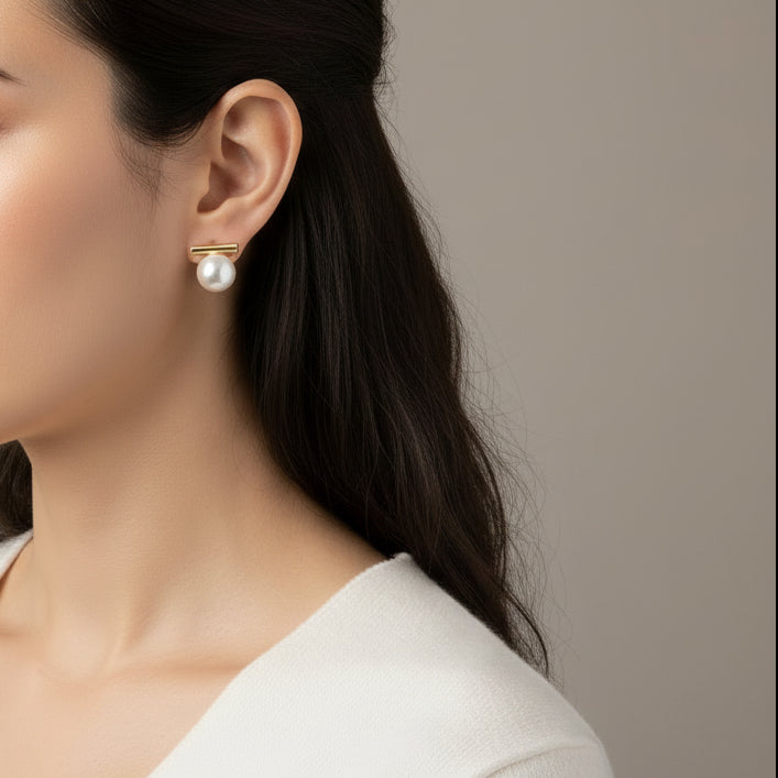 Minimalist gold bar stud earrings with white pearls. Lightweight, elegant design. Perfect for office wear & everyday sophistication.