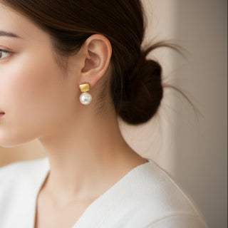 Modern gold drop earrings with textured square studs & white pearls. Lightweight, elegant design. Perfect for office wear & everyday sophistication.