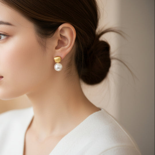 Modern gold drop earrings with textured square studs & white pearls. Lightweight, elegant design. Perfect for office wear & everyday sophistication.