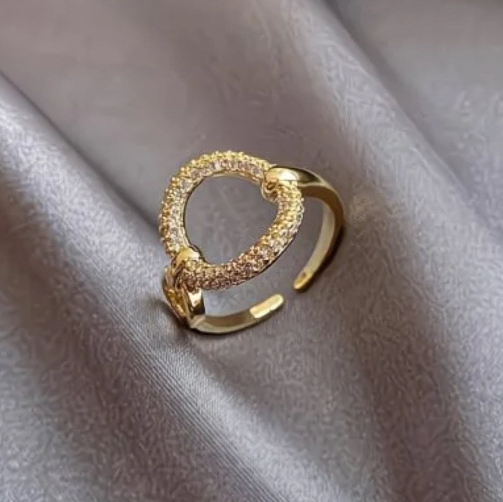Minimalist gold open ring with pavé cubic zirconia circle. Adjustable fit, stackable design. Perfect for everyday elegance & layering.