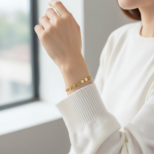 Delicate gold chain bracelet with textured fan-shaped links. Adjustable fit, stackable design. Perfect for everyday elegance & layering.