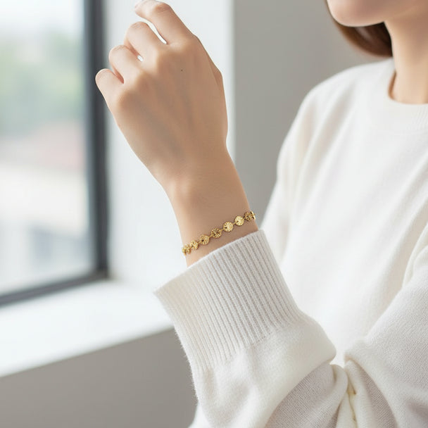 Delicate gold chain bracelet with textured fan-shaped links. Adjustable fit, stackable design. Perfect for everyday elegance & layering.