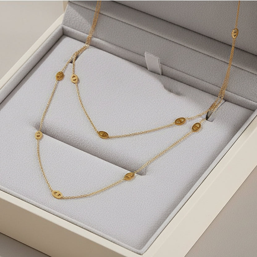 Modern layered disc chain necklace in gold or silver. 120cm long, adjustable fit. Perfect for everyday elegance & minimalist layering style.