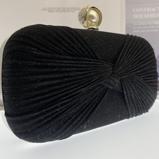 Elegant pleated evening clutch with pearl clasp. Black, silver & gold options. Dual chains for versatile wear. Perfect for weddings, galas, cocktail parties & formal events.