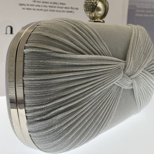 Elegant pleated evening clutch with pearl clasp. Black, silver & gold options. Dual chains for versatile wear. Perfect for weddings, galas, cocktail parties & formal events.
