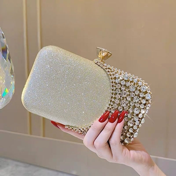 Glamorous rhinestone evening clutch with glitter PU finish. Crystal clasp & dual chains. Black, silver & gold options. Perfect for weddings, proms & cocktail parties.