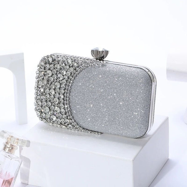 Glamorous rhinestone evening clutch with glitter PU finish. Crystal clasp & dual chains. Black, silver & gold options. Perfect for weddings, proms & cocktail parties.