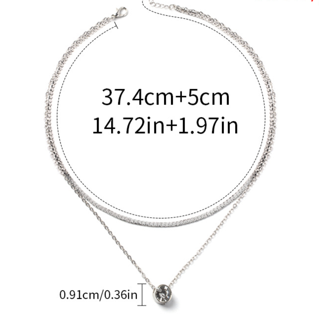 Elegant silver-plated double-layer necklace. Lightweight, delicate chains. Perfect for layering over sweaters & everyday elegance.