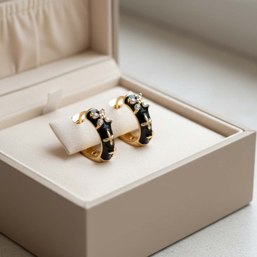 Edgy black enamel hoop earrings with gold cross & cubic zirconia. Lightweight medium hoops. Perfect for gothic style & bold everyday looks.