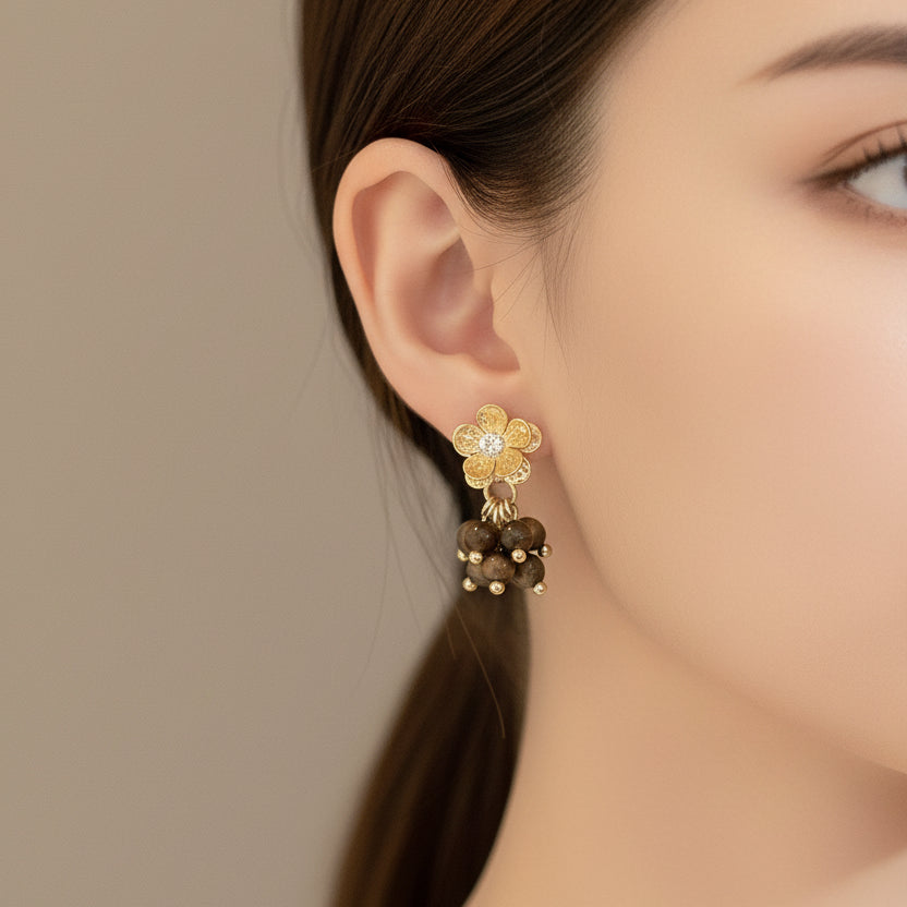 Elegant gold floral drop earrings with brown stone center. 5cm length, lightweight design. Perfect for boho style & everyday elegance.