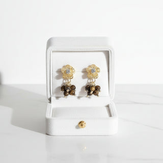 Elegant gold floral drop earrings with brown stone center. 5cm length, lightweight design. Perfect for boho style & everyday elegance.