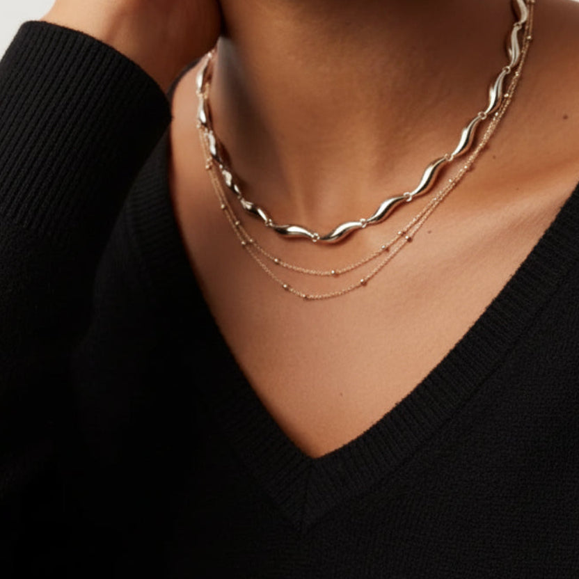 Elegant layered collarbone necklace with 3 chains in gold or silver. 18K plated, adjustable fit. Perfect for everyday elegance & modern style.