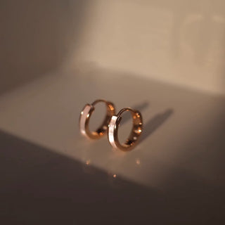 Delicate rose gold hoop earrings with high-shine finish. Lightweight, stackable design. Perfect for everyday elegance & minimalist style.