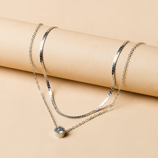 Elegant silver-plated double-layer necklace. Lightweight, delicate chains. Perfect for layering over sweaters & everyday elegance.