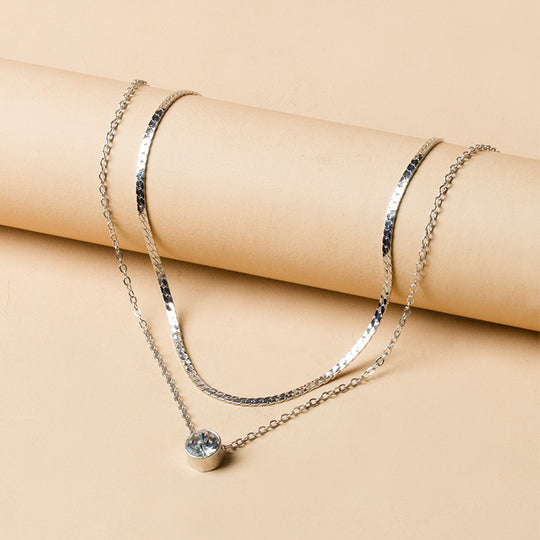 Elegant silver-plated double-layer necklace. Lightweight, delicate chains. Perfect for layering over sweaters & everyday elegance.