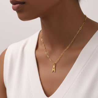 Personalized gold initial necklace with 3D letter pendant. Stainless steel, A-Z available. Perfect for everyday elegance & meaningful gifts.