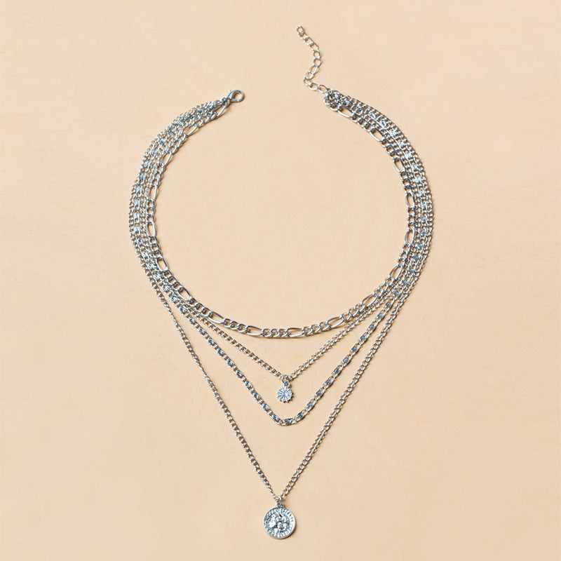 Elegant long layered chain necklace in gold or silver. Multi-strand design. Perfect for layering over sweaters & everyday elegance.