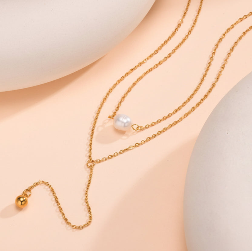 Elegant layered Y-necklace with white & gold pearls. Adjustable drop, gold chain. Perfect for evening glamour & everyday sophistication.