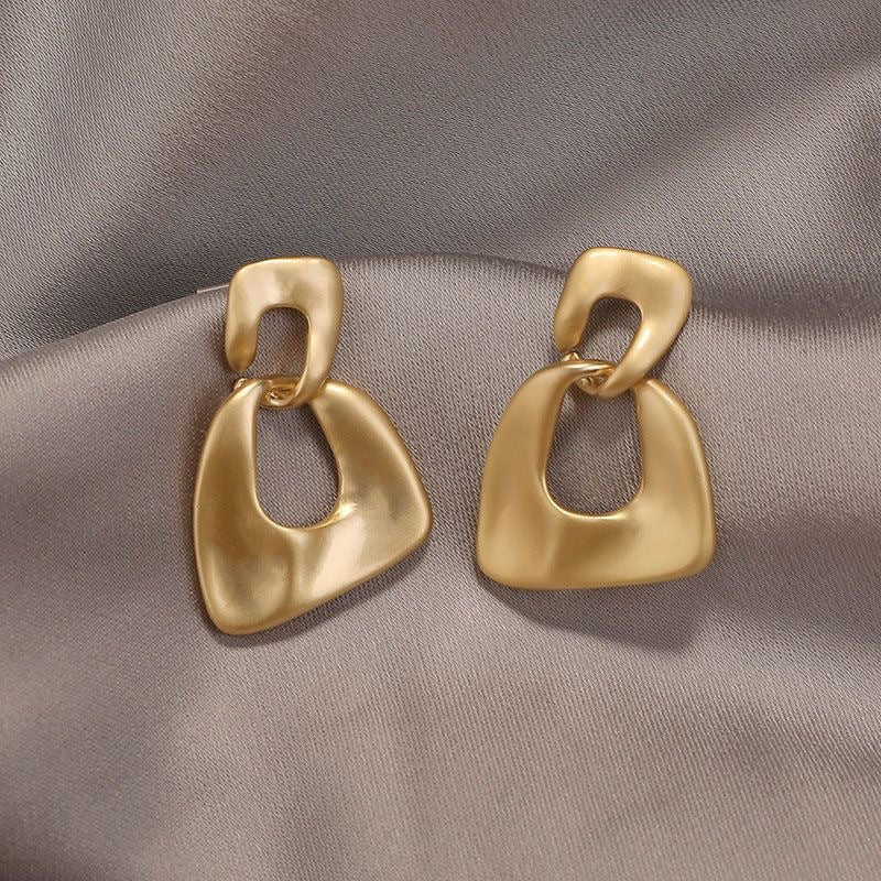 Artful gold drop earrings with sculpted organic links. Lightweight matte finish. Perfect for everyday elegance & modern style.