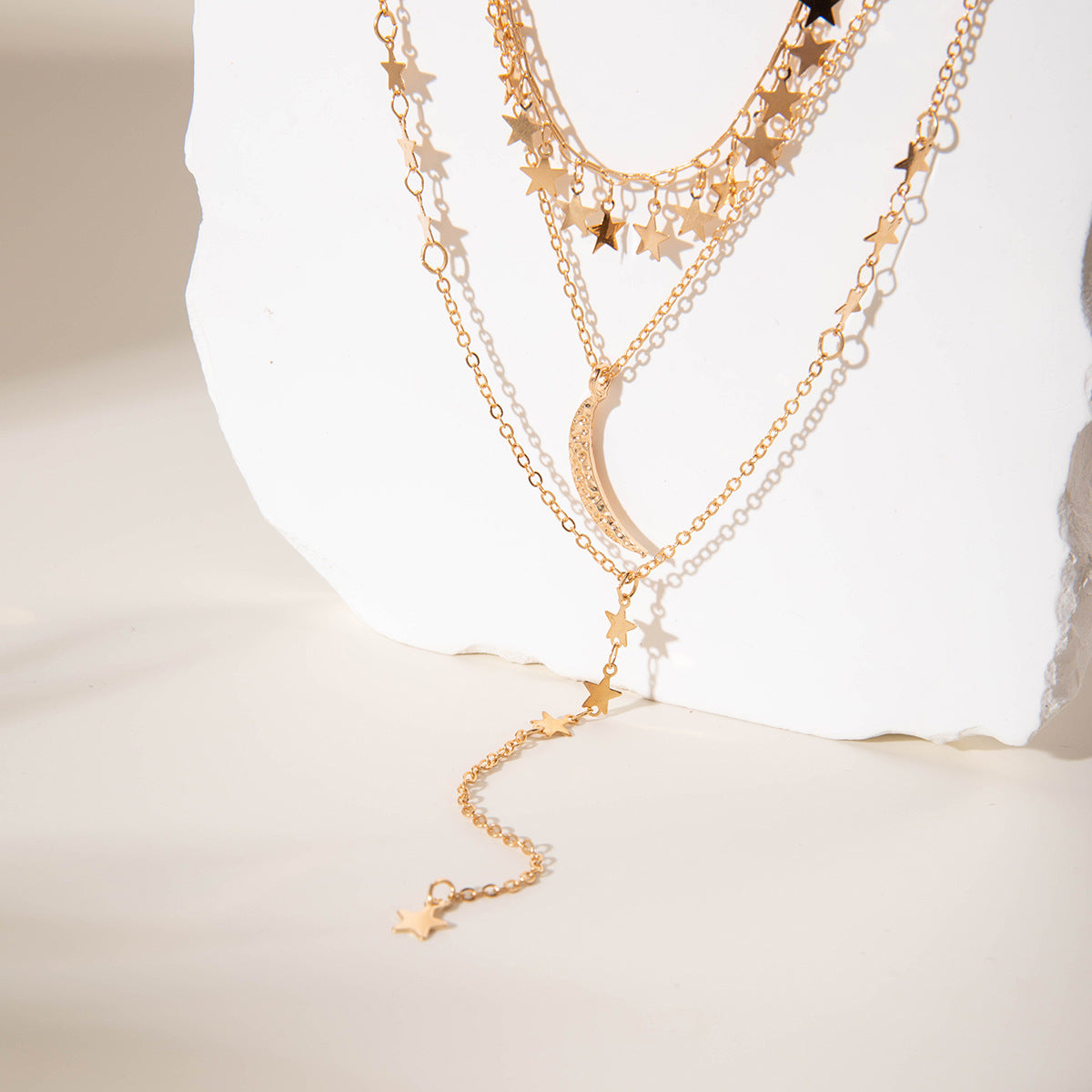 Elegant layered gold Y-necklace with half moon pendant. Delicate multi-chain design. Perfect for boho style & everyday elegance.