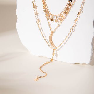 Elegant layered gold Y-necklace with half moon pendant. Delicate multi-chain design. Perfect for boho style & everyday elegance.