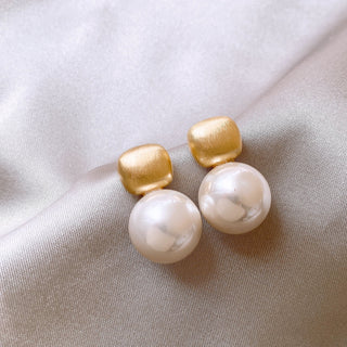 Modern gold drop earrings with textured square studs & white pearls. Lightweight, elegant design. Perfect for office wear & everyday sophistication.