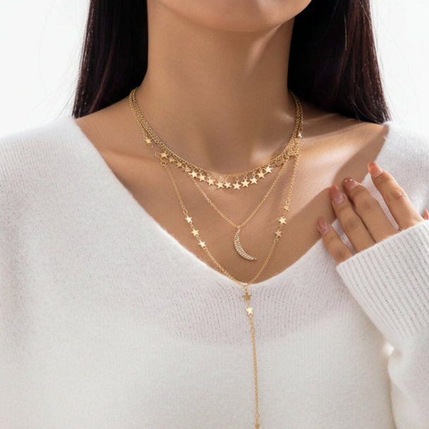 Elegant layered gold Y-necklace with half moon pendant. Delicate multi-chain design. Perfect for boho style & everyday elegance.