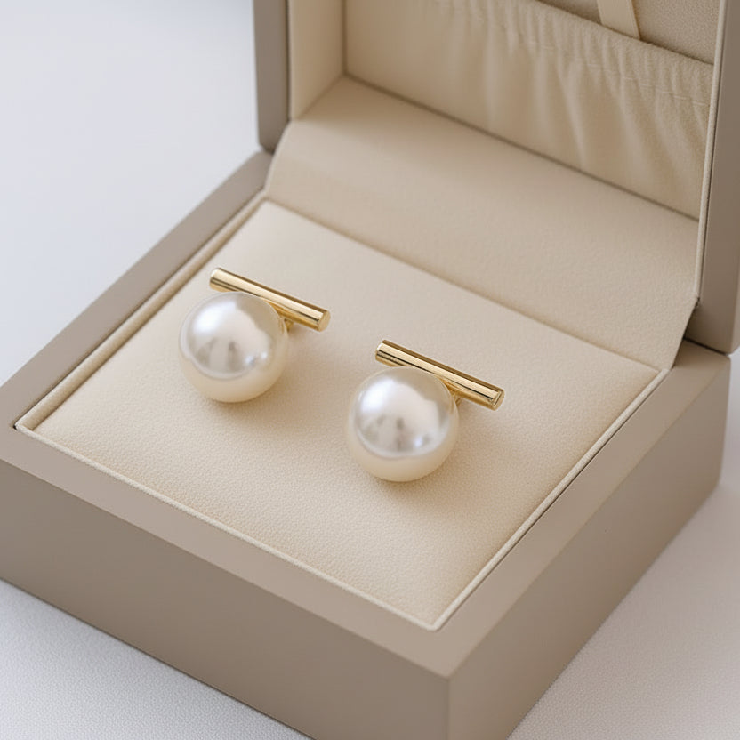 Minimalist gold bar stud earrings with white pearls. Lightweight, elegant design. Perfect for office wear & everyday sophistication.