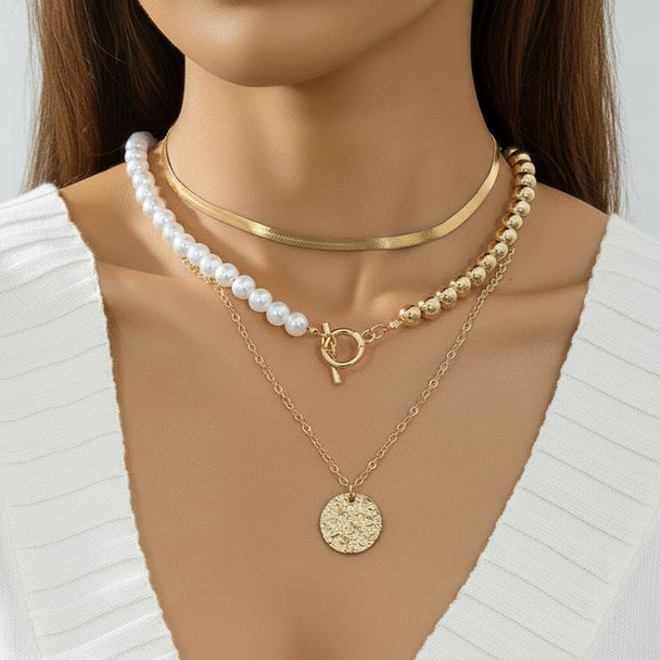 Elegant layered Y-necklace with faux pearls & gold pendants. Multi-strand bohemian design. Perfect for everyday elegance & special occasions.