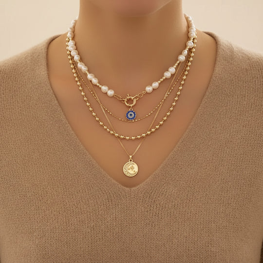 Bold layered pearl necklace with rhinestone pendants. Multi-strand collar design. Perfect for special occasions & statement style.