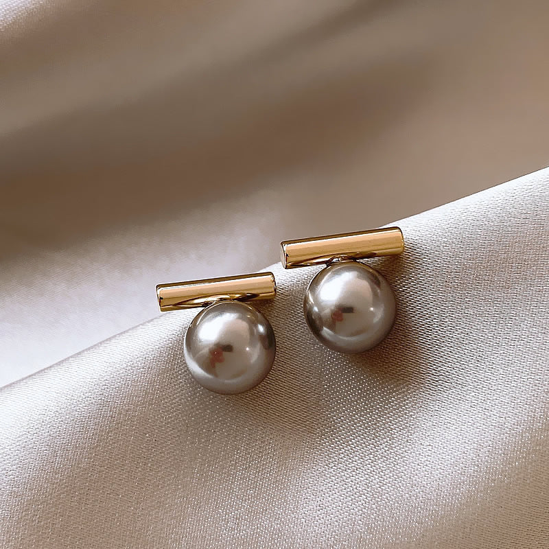 Modern gold bar stud earrings with gray pearls. Lightweight minimalist design. Perfect for office sophistication & everyday elegance.
