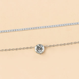 Elegant silver-plated double-layer necklace. Lightweight, delicate chains. Perfect for layering over sweaters & everyday elegance.