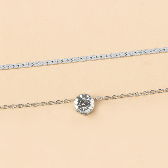 Elegant silver-plated double-layer necklace. Lightweight, delicate chains. Perfect for layering over sweaters & everyday elegance.